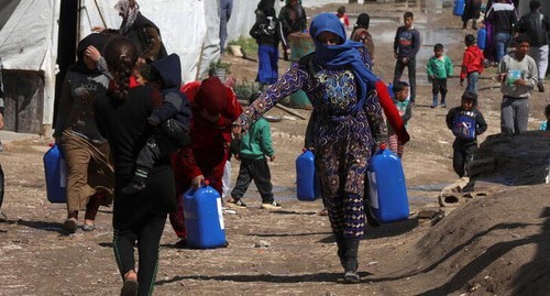 Syrian refugees in a tent camp. Photo: REUTERS/Mohamed Azakir