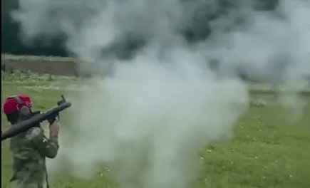 A child shooting from a grenade launcher. Screenshot of a video posted at the Lenta.ru website on 01.07.21, https://lenta.ru/news/2021/07/01/grntmt/