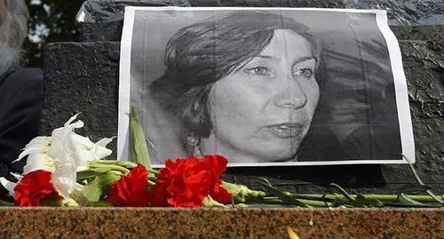 Flowers under the portrait of Natalia Estemirova. Photo: REUTERS/Denis Sinyakov