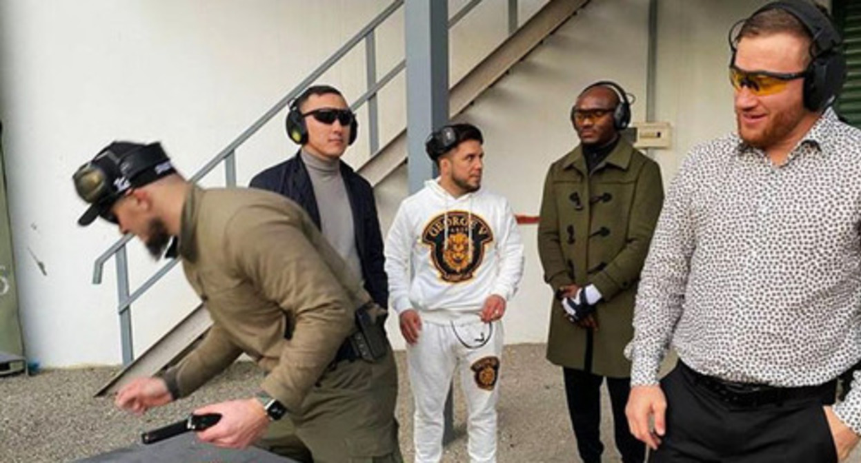 Justin Gaethje, Kamar Usman and Henry Cejudo (from left to right), the UFC fighters, at the military training ground in Chechnya, where they were allowed to fire machine guns and a grenade launcher. November 2022. Screenshot of the video by the Grozny TV channel