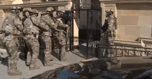 Law enforcers enter the Church of Archangel Mikhail in Grozny after it was attacked by the terrorists on May 19, 2018. Screenshot of the video published on the YouTube channel "Akhtuba" on May 19, 2018 https://www.youtube.com/watch?v=-NSpvypvCes