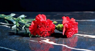 Carnations on a memorial. Picture made by Photoshop