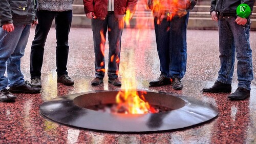 Men standing near the Eternal Flame. Picture made in Photoshop by the "Caucasian Knot"