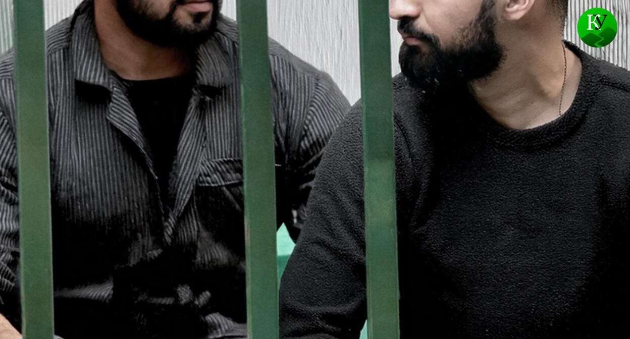 Two men behind bars. Picture made in Photoshop by the "Caucasian Knot"