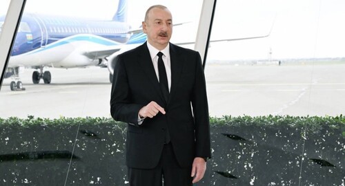 Ilham Aliev in the background of a plane. Photo: press service of the Azerbaijani President https://president.az/az/articles/view/67806