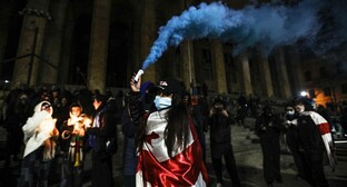 A protester holding a smoke bomb. December 6, 2024. Photo by Aziz Karimov for the "Caucasian Knot"